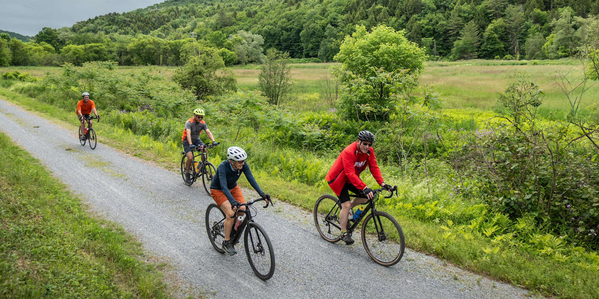 Discovery Bicycle Tours guests biking a trail in Lamoille Valley in Vermont